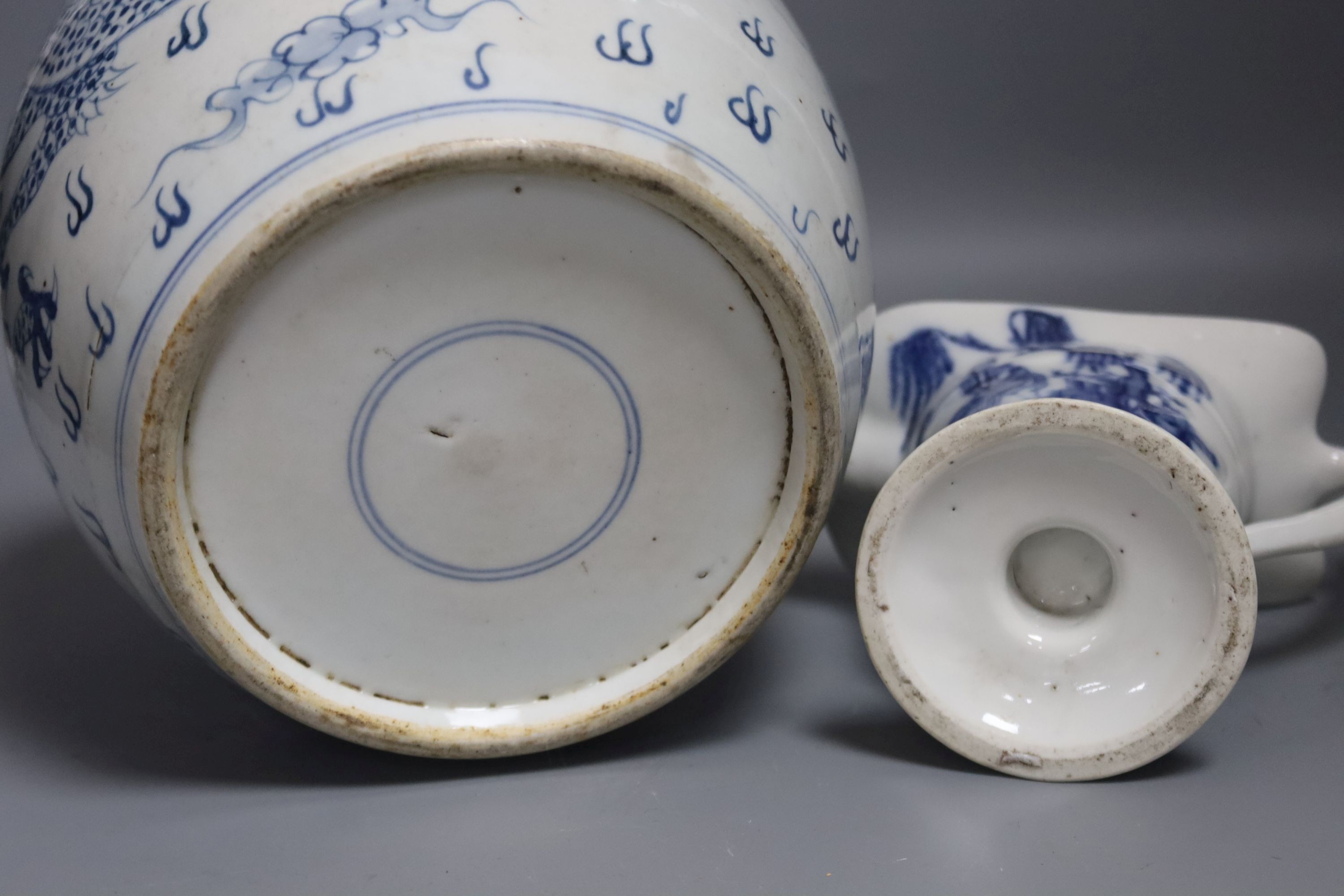 A Chinese blue and white jar, 20cm and a helmet shaped jug, 18th century and later